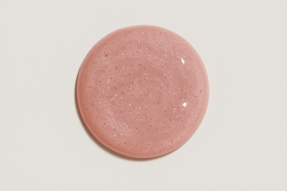 Circle of light pink, shimmery gloss on white background