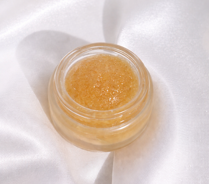 Small jar of cosmetic cream on a white fabric background